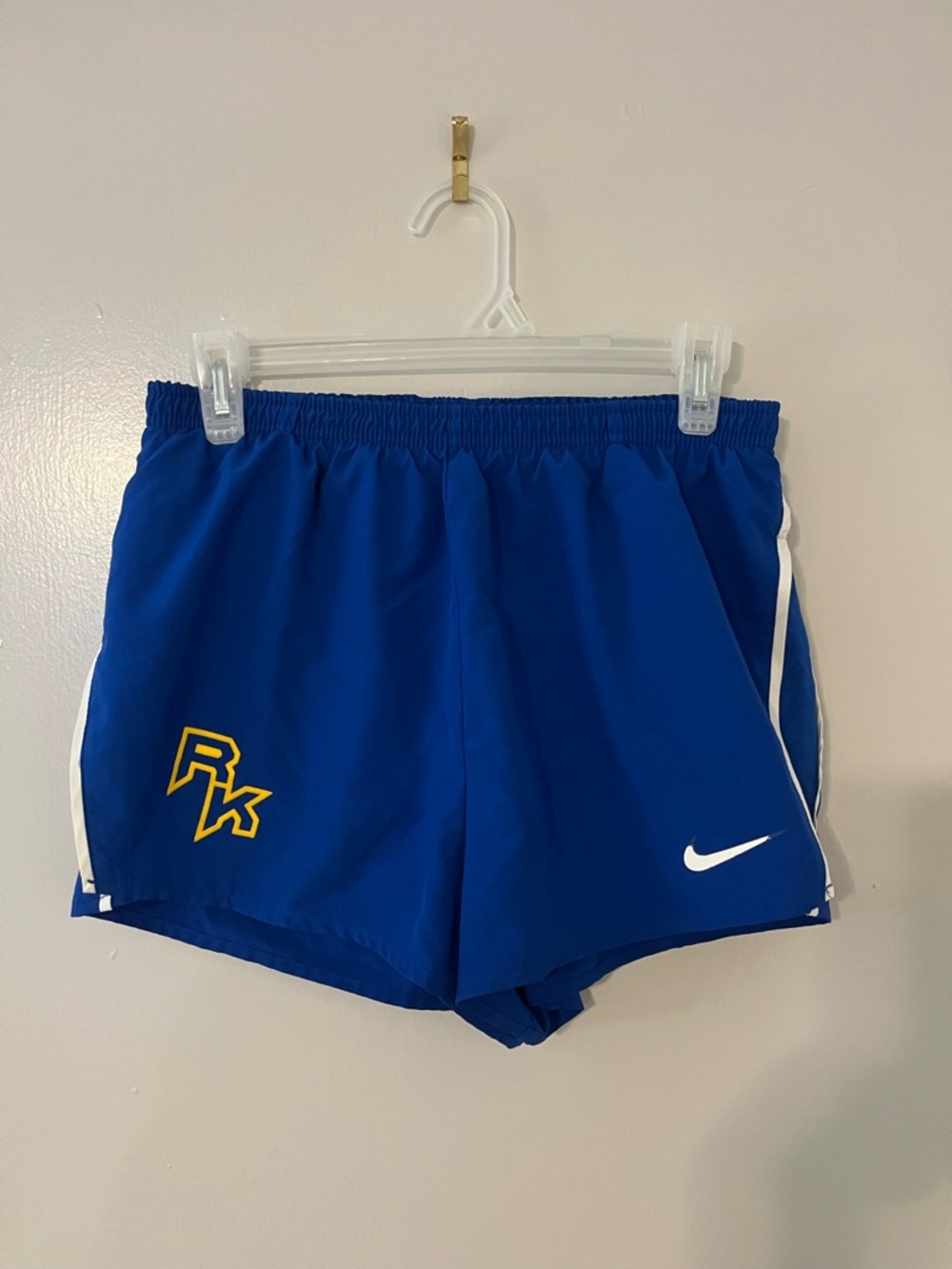 Nike Royal Blue Athletic Shorts with White Swoosh and Yellow Accent